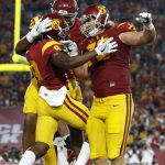 From left to right: Southern California wide receiver JuJu Smith-Schuster, offensive tackle Chuma Edoga and offensive tackle Chad Wheeler (72) celebrate after Smith-Schuster scored a touchdown during the first half of an NCAA college football game against Arizona State Saturday, Oct. 1, 2016, in Los Angeles. (AP Photo/Ryan Kang)
