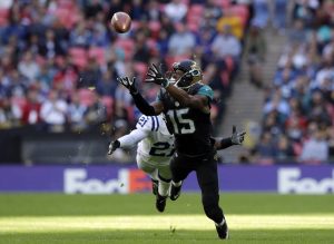 Jacksonville Jaguars wide receiver Allen Robinson (15) goes for a catch chased by Indianapolis Colts cornerback Vontae Davis (21) during an NFL football game between the Indianapolis Colts and the Jacksonville Jaguars at Wembley stadium in London, Sunday Oct. 2, 2016. (AP Photo/Matt Dunham)