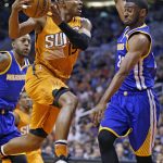 Phoenix Suns guard Leandro Barbosa, middle, drives past Golden State Warriors guard Ian Clark, right, and Andre Iguodala (9) during the second half of an NBA basketball game, Sunday, Oct. 30, 2016, in Phoenix. The Warriors defeated the Suns 106-100. (AP Photo/Ross D. Franklin)