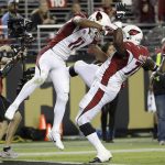 Arizona Cardinals wide receiver Larry Fitzgerald (11) celebrates his touchdown reception with guard Earl Watford during the second half of an NFL football game against the San Francisco 49ers in Santa Clara, Calif., Thursday, Oct. 6, 2016. (AP Photo/Marcio Jose Sanchez)