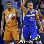 Golden State Warriors guard Stephen Curry (30) celebrates a basket as Phoenix Suns guard Leandro Barbosa (19) looks on during the second half of an NBA basketball game Sunday, Oct. 30, 2016, in Phoenix. The Warriors defeated the Suns 106-100. (AP Photo/Ross D. Franklin)