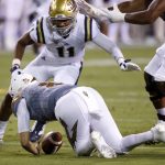 Arizona State's Brady White (2) recovers his own fumble as UCLA's Keisean Lucier-South (11) closes in during the first half of an NCAA college football game Saturday, Oct. 8, 2016, in Tempe, Ariz. (AP Photo/Ross D. Franklin)