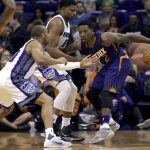 Phoenix Suns guard Eric Bledsoe (2) is pressured by Sacramento Kings forward Rudy Gay (8) and Sacramento Kings guard Arron Afflalo during the first half of an NBA basketball game, Wednesday, Oct. 26, 2016, in Phoenix. (AP Photo/Matt York)