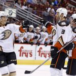 Anaheim Ducks' Michael Sgarbossa (48) celebrates his goal against the Arizona Coyotes with Clayton Stoner (3) and Brandon Montour (71) during the first period of a preseason NHL hockey game Saturday, Oct. 1, 2016, in Glendale, Ariz. (AP Photo/Ross D. Franklin)