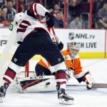 Philadelphia Flyers' Steve Mason, right, save a shot by Arizona Coyotes' Anthony Duclair during the first period of an NHL hockey game, Thursday, Oct. 27, 2016, in Philadelphia. (AP Photo/Tom Mihalek)