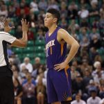 Phoenix Suns' Devin Booker (1) reacts to a foul being called against his team during the first half of an NBA preseason basketball game against the Utah Jazz on Wednesday, Oct. 12, 2016, in Salt Lake City. (AP Photo/Kim Raff)