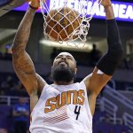 Phoenix Suns' Tyson Chandler dunks against the San Antonio Spurs during the second half of an NBA preseason basketball game Monday, Oct. 3, 2016, in Phoenix. The Suns won 91-86. (AP Photo/Ross D. Franklin)