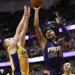 Phoenix Suns guard Leandro Barbosa, right, of Brazil, shoots as Los Angeles Lakers guard Marcelo Huertas, of Brazil, defends during the second half of an NBA preseason basketball game in Anaheim, Calif., Friday, Oct. 21, 2016. (AP Photo/Kelvin Kuo)