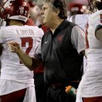Washington State coach Mike Leach makes a call during the second half of the team's NCAA college football game against Arizona State, Saturday, Oct. 22, 2016, in Tempe, Ariz. (AP Photo/Matt York)