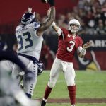 Arizona Cardinals quarterback Carson Palmer (3) throws over Seattle Seahawks defensive tackle Tony McDaniel (93) during the first half of a football game, Sunday, Oct. 23, 2016, in Glendale, Ariz. (AP Photo/Rick Scuteri)