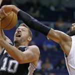 San Antonio Spurs' David Lee (10) has his shot blocked by Phoenix Suns' Tyson Chandler, right, during the first half of an NBA preseason basketball game Monday, Oct. 3, 2016, in Phoenix. (AP Photo/Ross D. Franklin)
