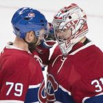 Montreal Canadiens goaltender Carey Price celebrates with teammate Andrei Markov (79) following their win over the Arizona Coyotes in an NHL hockey game, Thursday, Oct. 20, 2016 in Montreal. (Graham Hughes/The Canadian Press via AP)