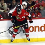 Ottawa Senators' Cody Ceci (5) checks Arizona Coyotes' Laurent Dauphin during the first period of an NHL hockey game Tuesday, Oct. 18, 2016, in Ottawa, Ontario. (Fred Chartrand/The Canadian Press via AP)