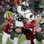 New York Jets running back Matt Forte (22) is hit by Arizona Cardinals nose tackle Josh Mauro (97) during the first half of an NFL football game, Monday, Oct. 17, 2016, in Glendale, Ariz. (AP Photo/Rick Scuteri)