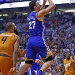 Golden State Warriors center Zaza Pachulia (27) drives past Phoenix Suns center Tyson Chandler (4) for a score during the first half of an NBA basketball game Sunday, Oct. 30, 2016, in Phoenix. (AP Photo/Ross D. Franklin)