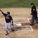 Cleveland Indians' Carlos Santana celebrates after hitting a home run off Chicago Cubs starting pitcher John Lackey during the second inning of Game 4 of the Major League Baseball World Series Saturday, Oct. 29, 2016, in Chicago. (AP Photo/David J. Phillip)