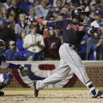 Cleveland Indians' Carlos Santana hits a home run off Chicago Cubs starting pitcher John Lackey during the second inning of Game 4 of the Major League Baseball World Series Saturday, Oct. 29, 2016, in Chicago. (AP Photo/David J. Phillip)