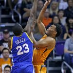 Phoenix Suns forward T.J. Warren, right, has his shot blocked by Golden State Warriors forward Draymond Green (23) during the first half of an NBA basketball game Sunday, Oct. 30, 2016, in Phoenix. (AP Photo/Ross D. Franklin)