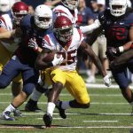 Southern California running back Ronald Jones II (25) runs for a first down down during the first half of an NCAA college football game against Arizona, Saturday, Oct. 15, 2016, in Tucson, Ariz. (AP Photo/Rick Scuteri)