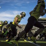 Oregon warms up before playing Arizona State in an NCAA college football game Saturday, Oct. 29, 2016 in Eugene, Ore. (AP Photo/Thomas Boyd)