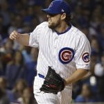Chicago Cubs starting pitcher John Lackey reacts after striking out Cleveland Indians' Francisco Lindor during the first inning of Game 4 of the Major League Baseball World Series Saturday, Oct. 29, 2016, in Chicago. (AP Photo/David J. Phillip)