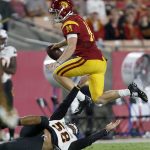 Southern California quarterback Sam Darnold (14) leaps over Arizona State linebacker Salamo Fiso during the second half of an NCAA college football game Saturday, Oct. 1, 2016, in Los Angeles. (AP Photo/Ryan Kang)