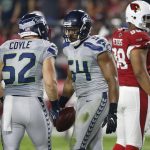Seattle Seahawks middle linebacker Bobby Wagner (54) celebrates his blocked field goal attempt against the Arizona Cardinals with teammate Brock Coyle (52) during the first half of a football game, Sunday, Oct. 23, 2016, in Glendale, Ariz. (AP Photo/Ross D. Franklin)
