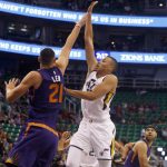 Utah Jazz's Dante Exum, right, shoots as Phoenix Suns' Alex Len (21) defends during the first half of an NBA preseason basketball game Wednesday, Oct. 12, 2016, in Salt Lake City. (AP Photo/Kim Raff)