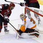 Arizona Coyotes' Martin Hanzal (11) scores a goal against Philadelphia Flyers' Steve Mason (35) during the first period of an NHL hockey game Saturday, Oct. 15, 2016, in Glendale, Ariz. (AP Photo/Ross D. Franklin)