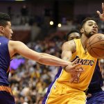 Los Angeles Lakers guard D'Angelo Russell (1) loses the ball while being fouled by Phoenix Suns guard Devin Booker, left, during the first half of an NBA preseason basketball game in Anaheim, Calif., Friday, Oct. 21, 2016. (AP Photo/Kelvin Kuo)