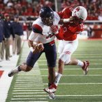 Arizona quarterback Brandon Dawkins (13) is driven out of bounds by Utah defensive back Chase Hansen (22) during the first half of an NCAA college football game, Saturday, Oct. 8, 2016, in Salt Lake City. (AP Photo/George Frey)