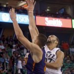 Utah Jazz's Rudy Gobert, right, shoots as Phoenix Suns' Alex Len defends during the first half of an NBA preseason basketball game Wednesday, Oct. 12, 2016, in Salt Lake City. (AP Photo/Kim Raff)