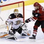 Anaheim Ducks goalie Jonathan Bernier (1) makes a save on a shot by Arizona Coyotes' Christian Dvorak (18) during overtime of a preseason NHL hockey game Saturday, Oct. 1, 2016, in Glendale, Ariz.  The Coyotes defeated the Ducks 3-2. (AP Photo/Ross D. Franklin)