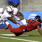Arizona wide receiver Nate Phillips (11) fumbles the ball after being pressured by Stanford cornerback Treyjohn Butler (6) during the second half of an NCAA college football game, Saturday, Oct. 29, 2016, in Tucson, Ariz. Stanford defeated Arizona 34-10. (AP Photo/Rick Scuteri)
