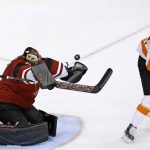 Arizona Coyotes' Mike Smith, left, makes a save on a shot as Philadelphia Flyers' Wayne Simmonds (17) watches the puck during the first period of an NHL hockey game, Saturday, Oct. 15, 2016, in Glendale, Ariz. (AP Photo/Ross D. Franklin)