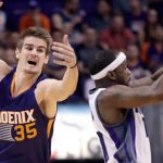 Phoenix Suns forward Dragan Bender (35), of Croatia, and Sacramento Kings guard Ty Lawson (10) battle for the ball during the second half of an NBA basketball game, Wednesday, Oct. 26, 2016, in Phoenix. (AP Photo/Matt York)