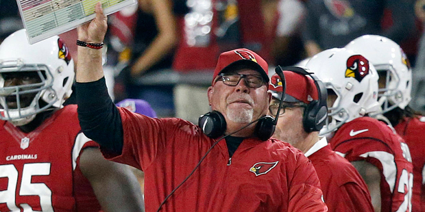 Arizona Cardinals head coach Bruce Arians yells during the first half of a football game against th...
