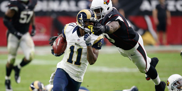 Los Angeles Rams wide receiver Tavon Austin (11) is grabbed by Arizona Cardinals tight end Ifeanyi ...