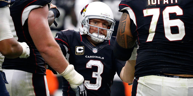 Arizona Cardinals quarterback Carson Palmer (3) is helped up after a being sacked against the Los A...