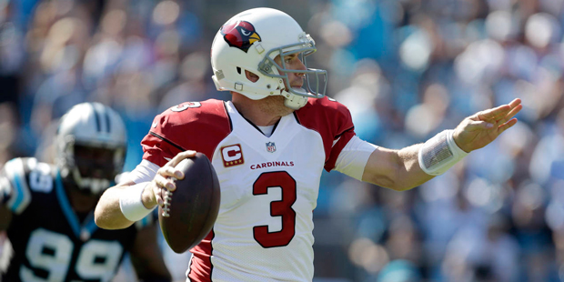 Arizona Cardinals' Carson Palmer (3) looks to pass against the Carolina Panthers in the first quart...