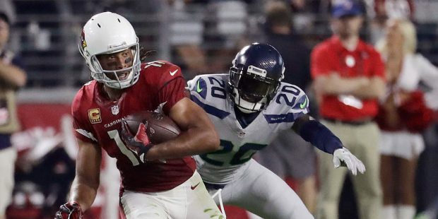 Arizona Cardinals wide receiver Larry Fitzgerald (11) runs after the catch as Seattle Seahawks corn...