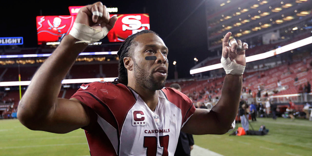Arizona Cardinals wide receiver Larry Fitzgerald walks off the field after the Cardinals defeated t...
