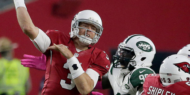 Arizona Cardinals quarterback Carson Palmer (3) is pressured by New York Jets defensive end Muhamma...