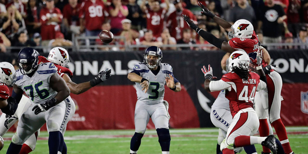 Seattle Seahawks quarterback Russell Wilson (3) throws against the Arizona Cardinals during the fir...