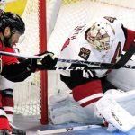 Ottawa Senators' Derick Brassard (19) fights for the puck with Arizona Coyotes' Brad Richardson (15) as Coyotes goaltender Mike Smith attempts to save the puck during the first period of an NHL hockey game Tuesday, Oct. 18, 2016, in Ottawa, Ontario. (Fred Chartrand/The Canadian Press via AP)