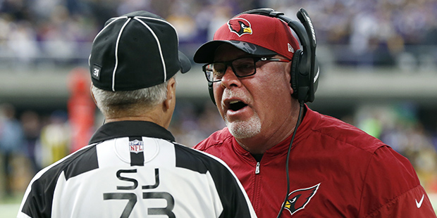 Arizona Cardinals head coach Bruce Arians, right, argues a call with side judge Joe Larrew during t...