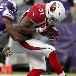 Arizona Cardinals running back David Johnson (31) catches a touchdown pass in front of Minnesota Vikings cornerback Captain Munnerlyn, left, during the second half of an NFL football game Sunday, Nov. 20, 2016, in Minneapolis. (AP Photo/Andy Clayton-King)