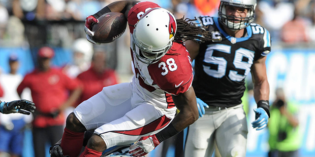 FILE - In this Oct. 30, 2016, file photo, Arizona Cardinals' Andre Ellington (38) is tackled by Carolina Panthers' Leonard Johnson (23) in the second half of an NFL football game in Charlotte, N.C. Panthers cornerback Leonard Johnson made a big impact in his first game with Carolina last Sunday with eight tackles and a sack against the Arizona Cardinals. (AP Photo/Mike McCarn, File)