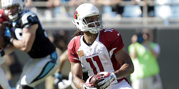 Arizona Cardinals' Larry Fitzgerald (11) controls a pass and makes his turn against the Carolina Pa...