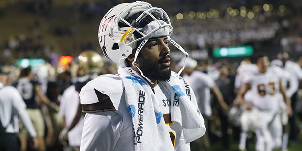 Arizona State quarterback Manny Wilkins heads to the locker room after facing Colorado in the secon...